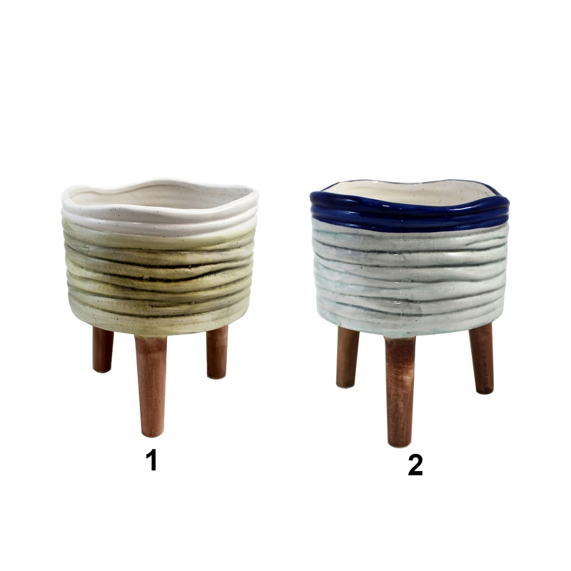 Pot en céramique avec motif ligné sur pattes en bois