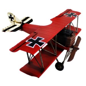 Avion biplan en métal rouge antique